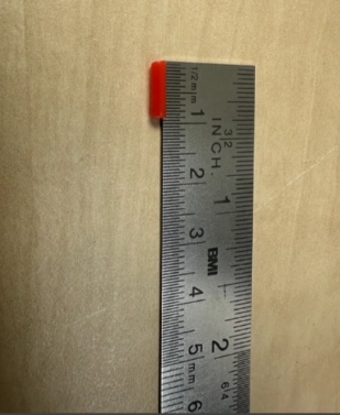 Cutting the straw to approximately 1cm using a ruler
